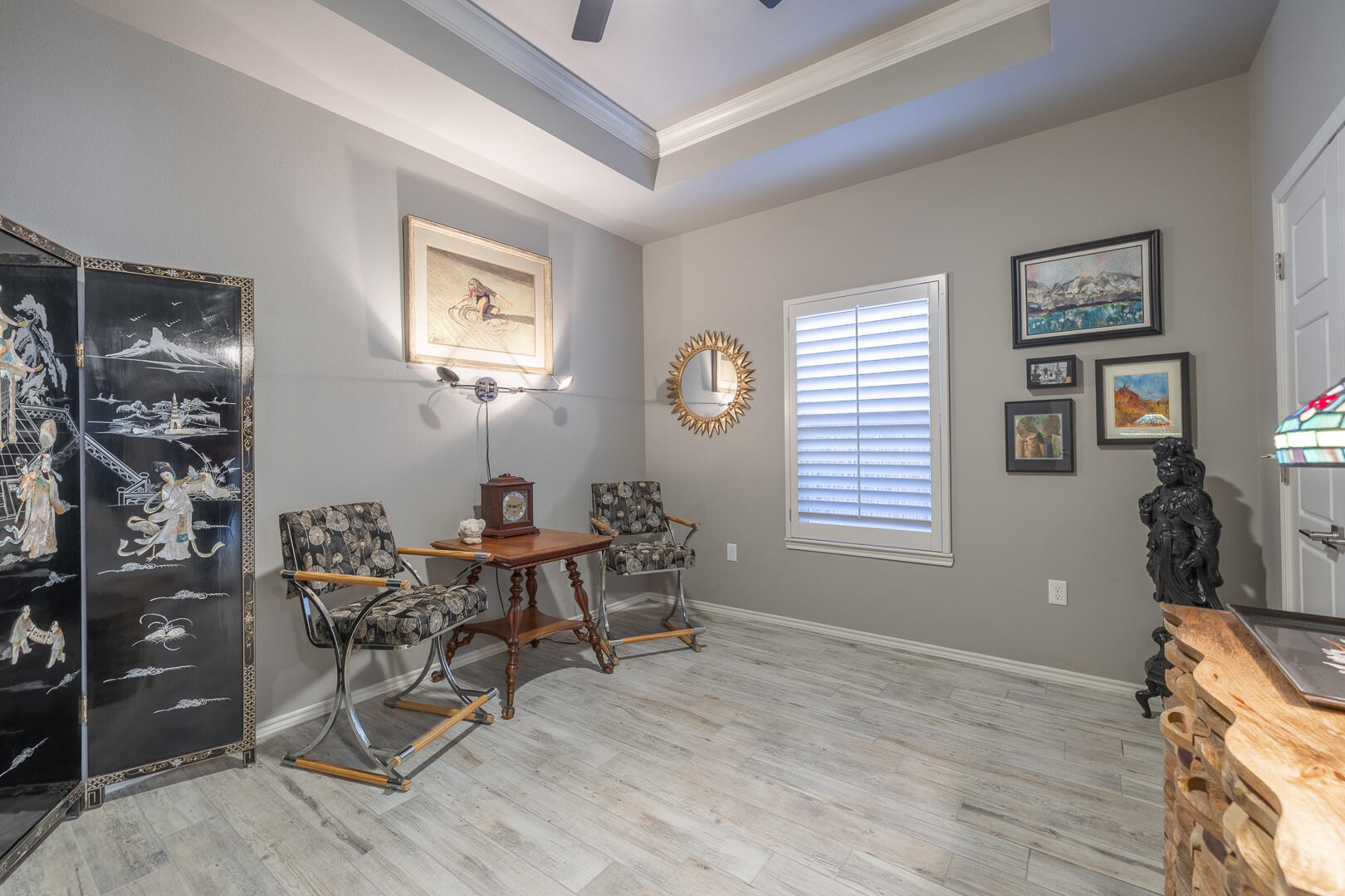 2109 101st Street Lubbock, TX 79423 - Photo 13 of 49 a workspace with wooden floor and a window
