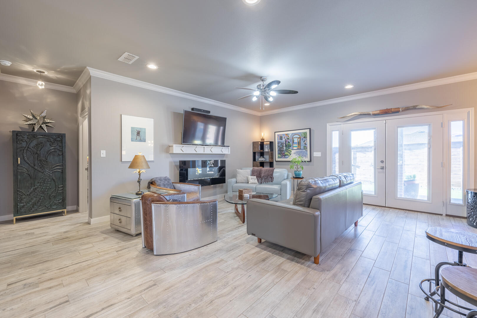 2109 101st Street Lubbock, TX 79423 - Photo 17 of 49 a living room with furniture and a fireplace