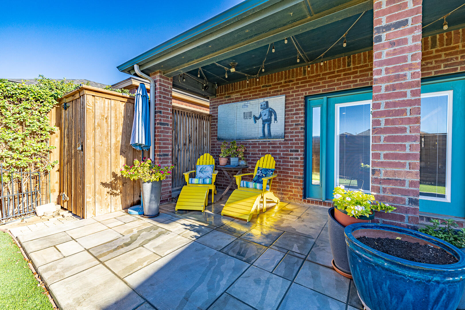 2109 101st Street Lubbock, TX 79423 - Photo 45 of 49 a view of a chairs and table in a patio