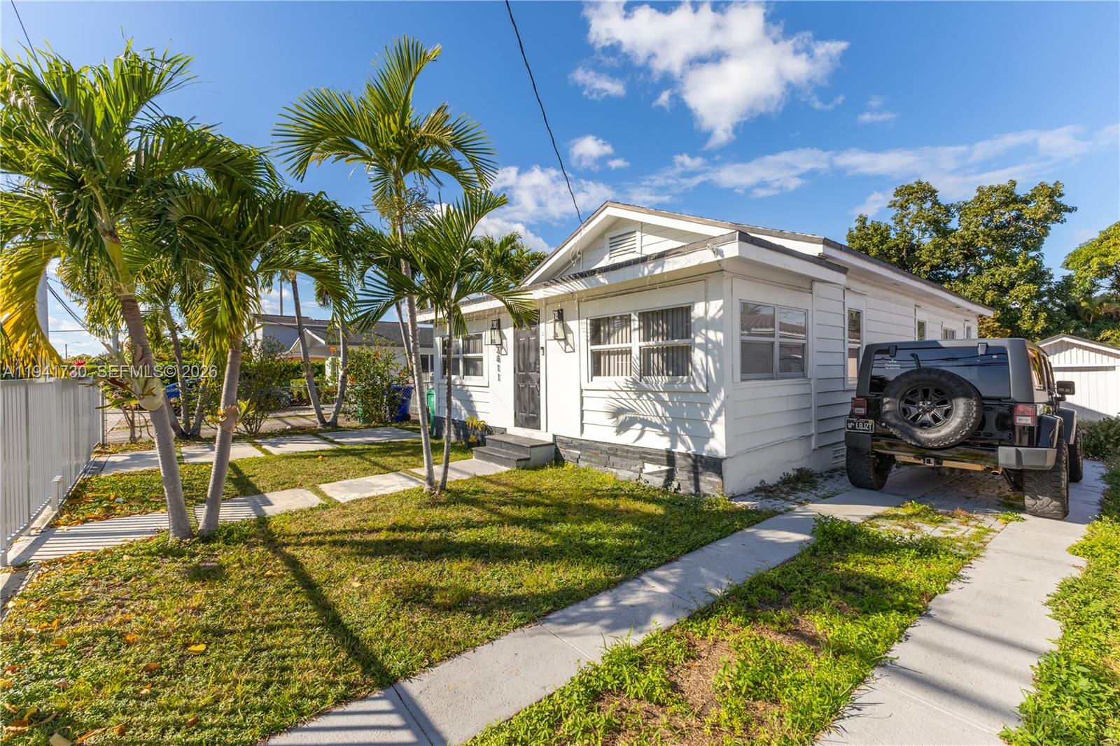 2811 Southwest 17th Street Miami, FL 33145 - Photo 2 of 36 a front view of a house with garden