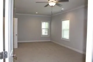 a view of an empty room with a window