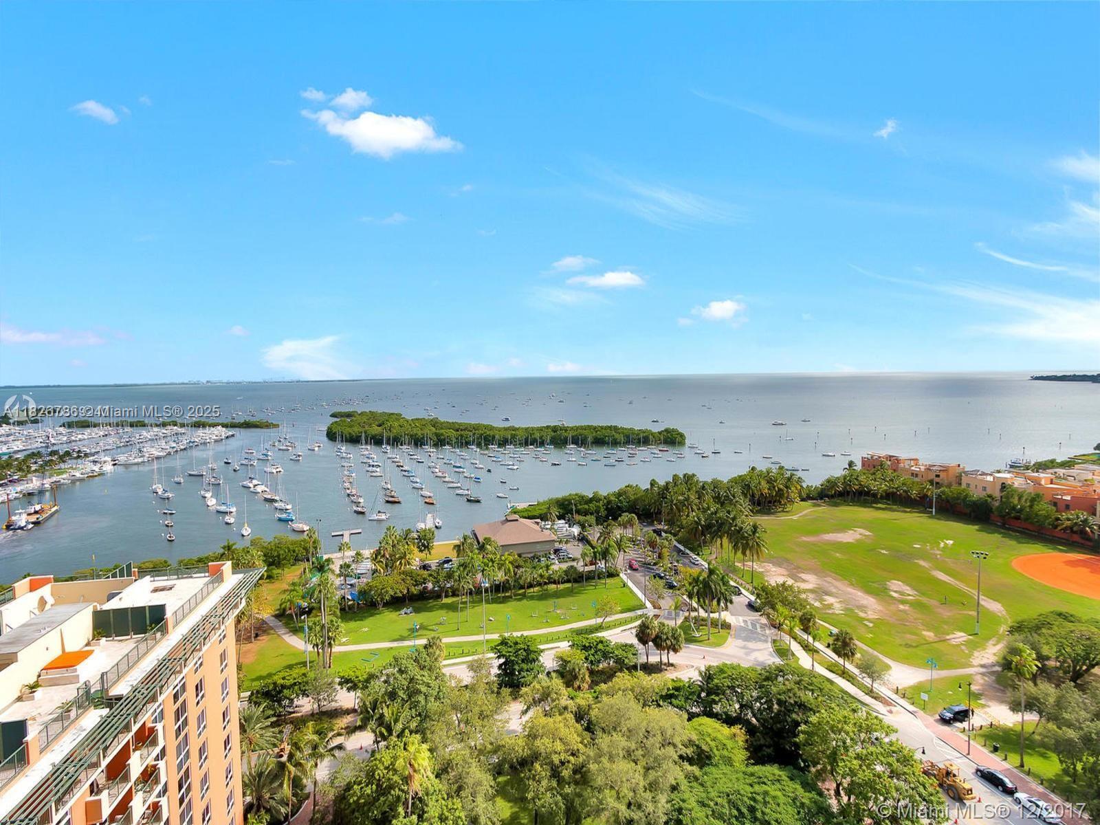 a view of a city with an ocean