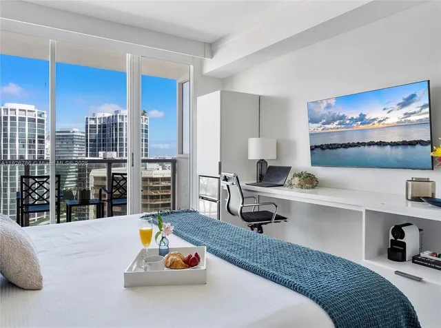 a bedroom with a bed and window