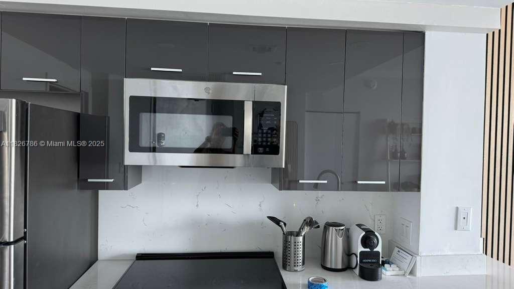2889 McFarlane Road, Unit 1908 Miami, FL 33133 - Photo 7 of 26 a bathroom with a double vanity sink