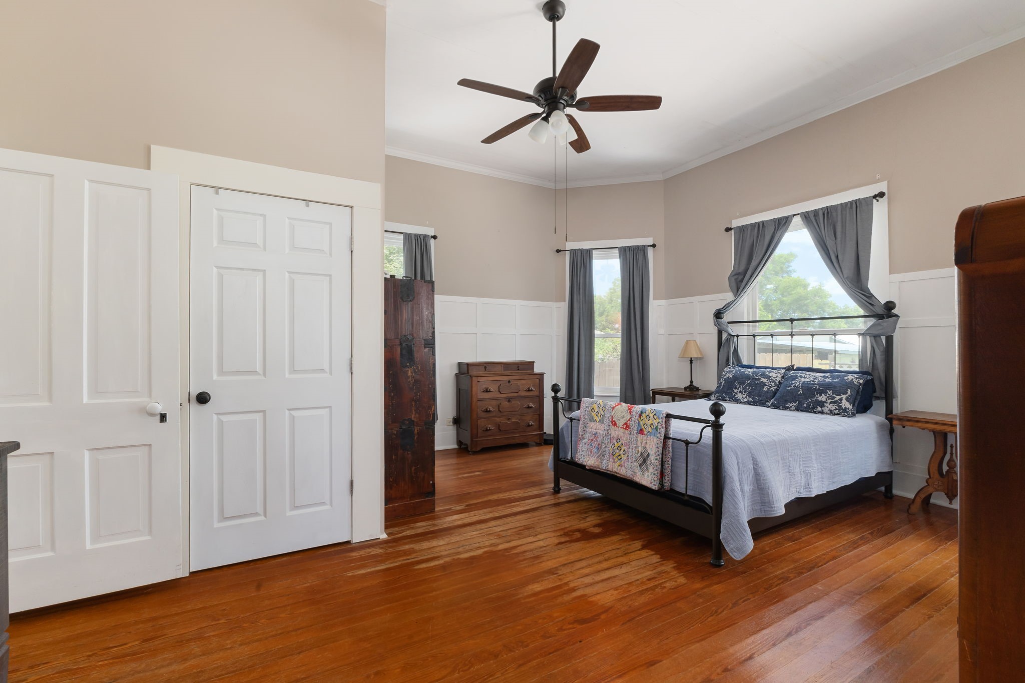 515 Wolf Street Schulenburg, TX 78956 - Photo 19 of 39 a bedroom with a bed and wooden floor