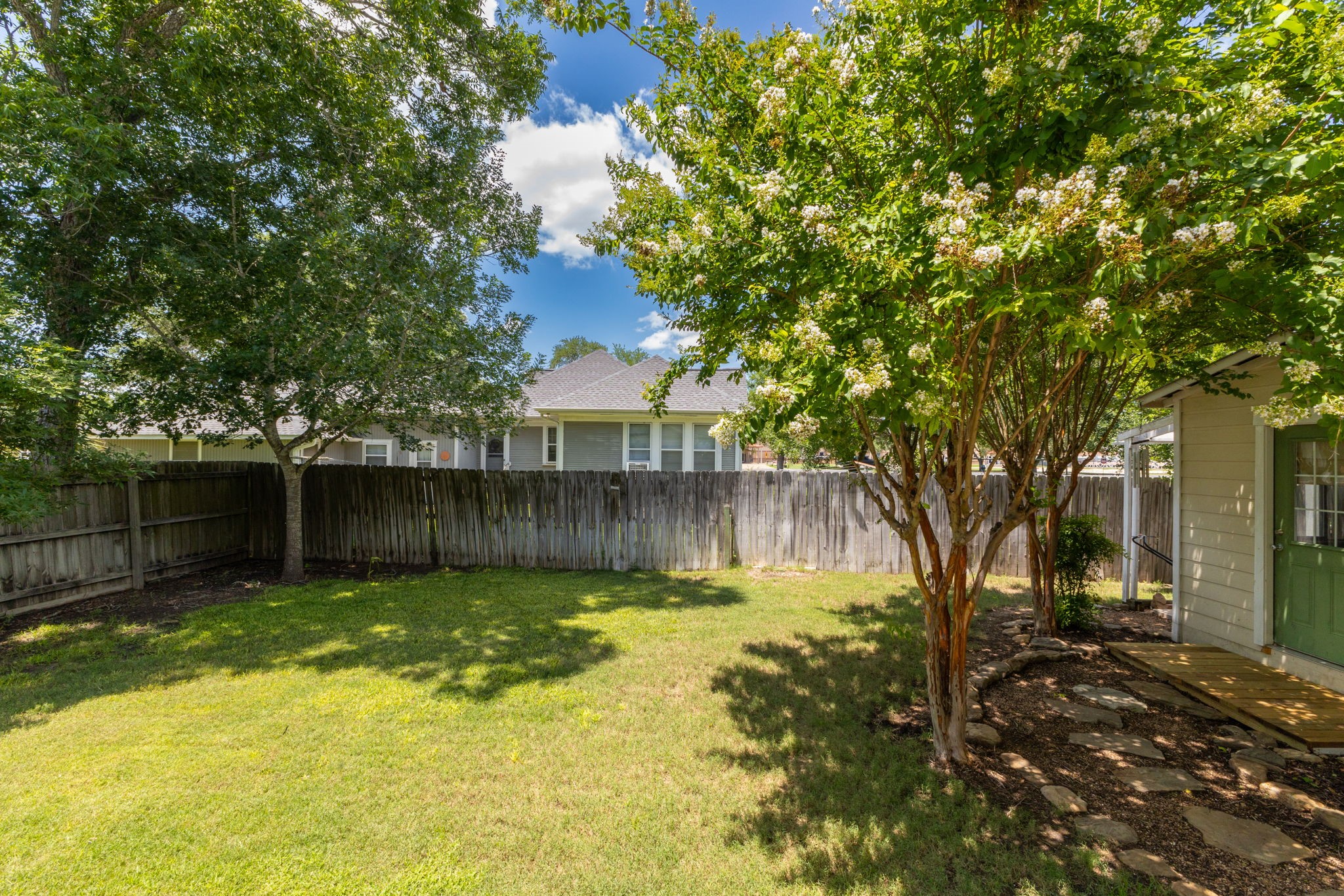 515 Wolf Street Schulenburg, TX 78956 - Photo 33 of 39 a view of a backyard with a small cabin