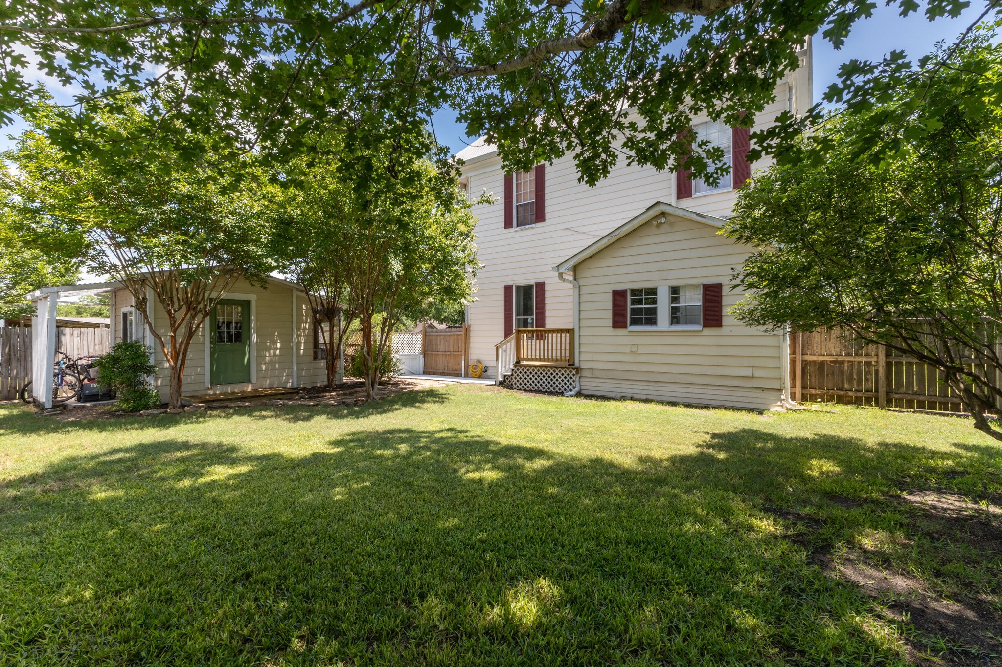 515 Wolf Street Schulenburg, TX 78956 - Photo 35 of 39 a house that has a big yard with large trees