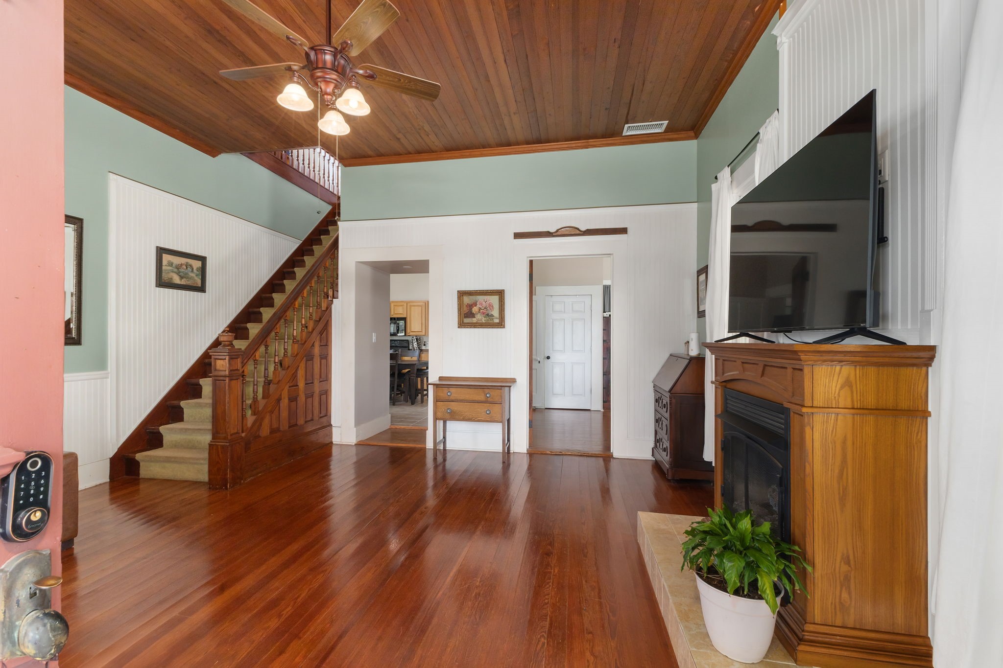 515 Wolf Street Schulenburg, TX 78956 - Photo 5 of 39 a view of a hallway with wooden floor and staircase