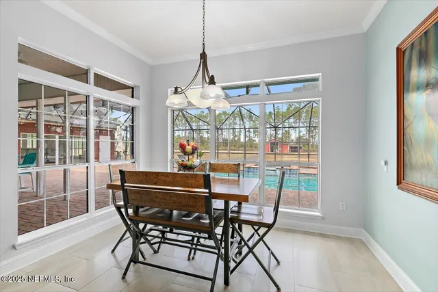 a view of a hallway with wooden floor and windows