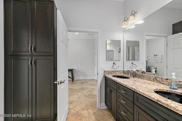 a bathroom with a glass shower door and a mirror