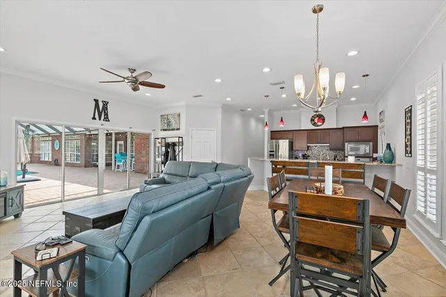 a living room with kitchen island furniture and a wooden floor