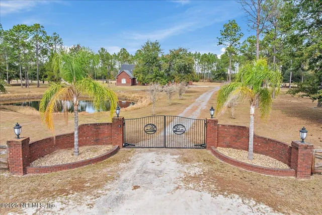 an aerial view of a house with swimming pool