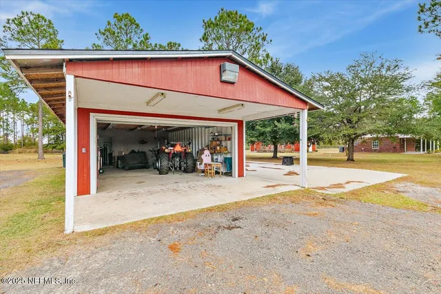a front view of a house with large yard and garage