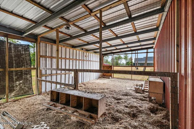 a bedroom with a bed and a night stand