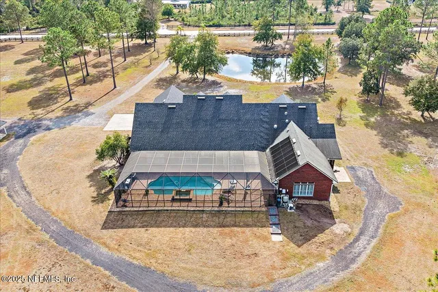 a view of a backyard with swimming pool