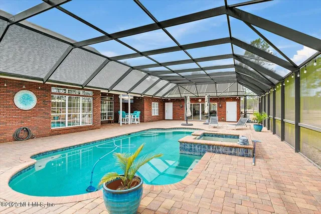 a view of indoor pool and sitting area