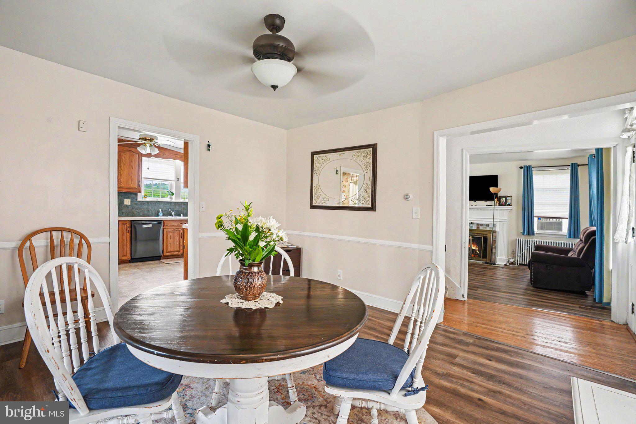 420 Carlisle Road Biglerville, PA 17307 - Photo 17 of 41 a dining room with furniture potted plants and wooden floor