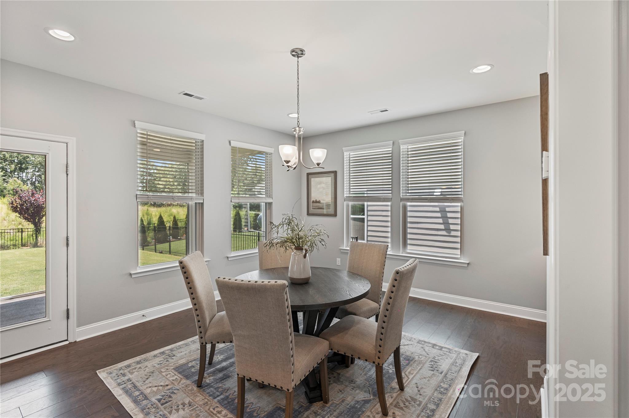 2225 Masons Bend Drive Fort Mill, SC 29708 - Photo 18 of 45 a view of a dining room with furniture window and wooden floor