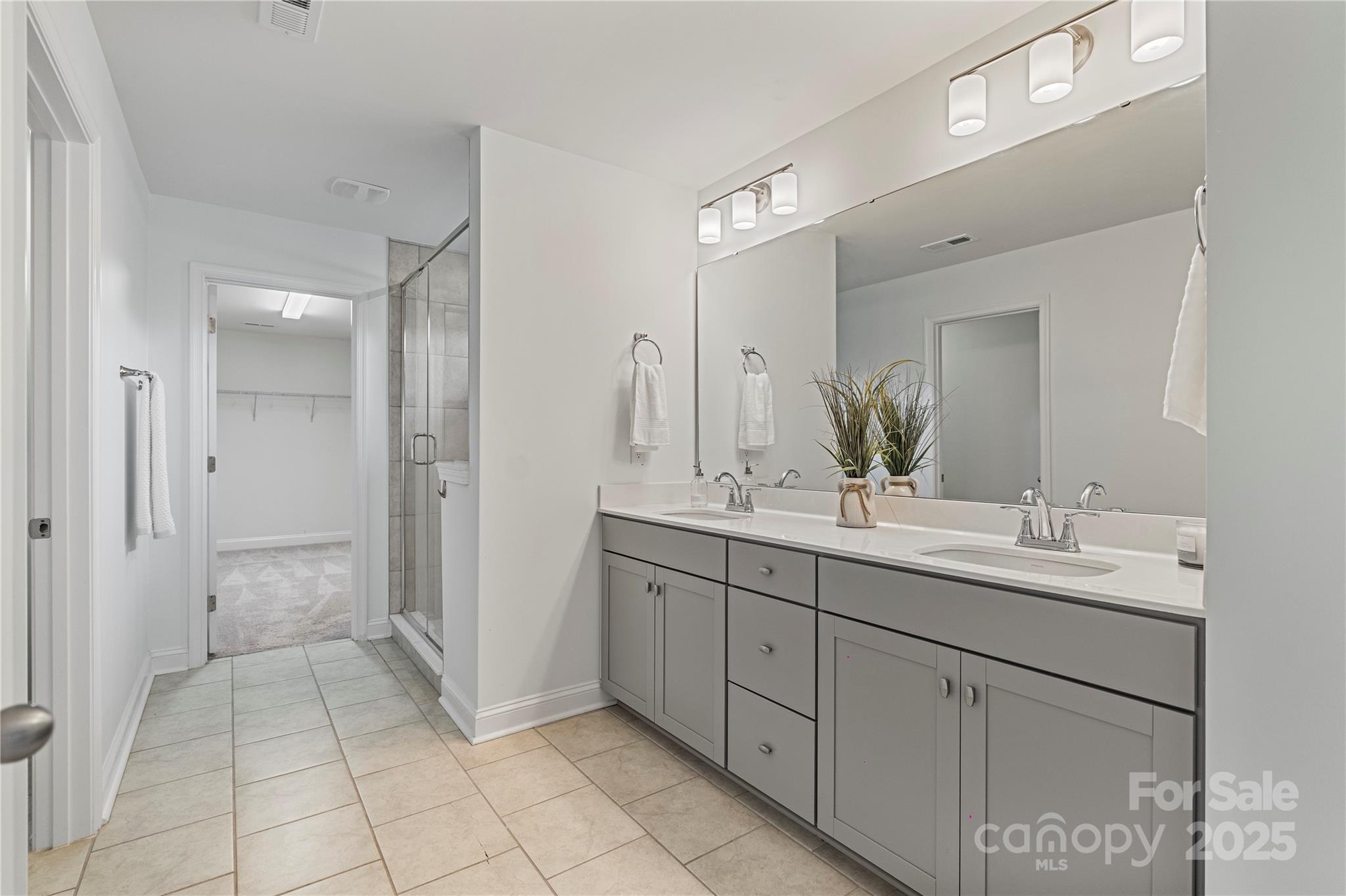 2225 Masons Bend Drive Fort Mill, SC 29708 - Photo 31 of 45 a spacious bathroom with a granite countertop sink mirror and a