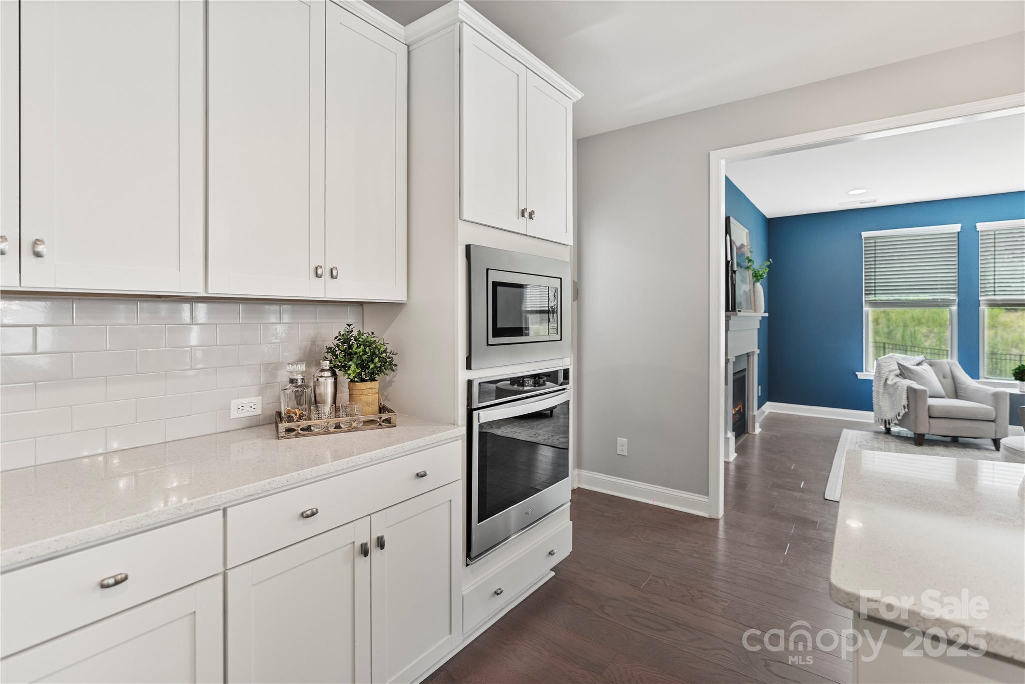 2225 Masons Bend Drive Fort Mill, SC 29708 - Photo 8 of 45 a kitchen with stainless steel appliances granite countertop white cabinets a sink and dishwasher