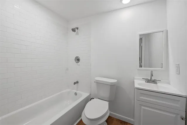 a bathroom with a toilet sink and bathtub