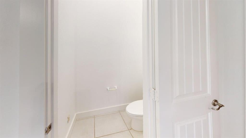 101 Rocky Pine Road McKinney, TX 75072 - Photo 35 of 39 a white toilet sitting next to a shower
