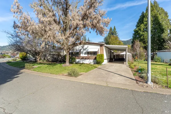 front view of a house with a yard