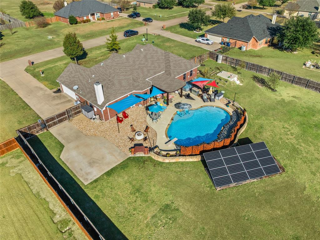 112 Springfield Lane Red Oak, TX 75165 - Photo 37 of 40 an aerial view of a pool a fireplace yard and mountain view in back