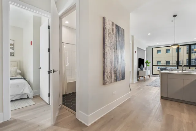 a view of a kitchen center island cabinets and wooden floor