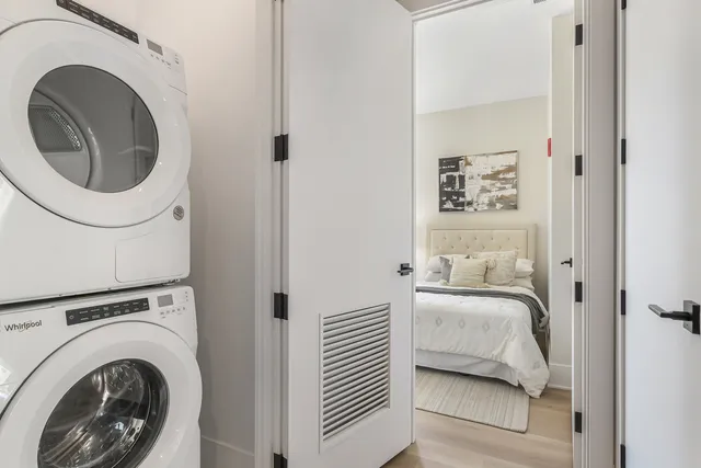 a bedroom with a bed and utility room