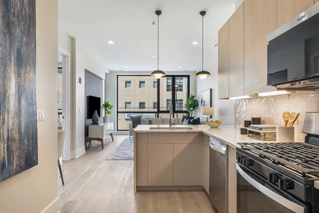 a kitchen with a sink stove and cabinets
