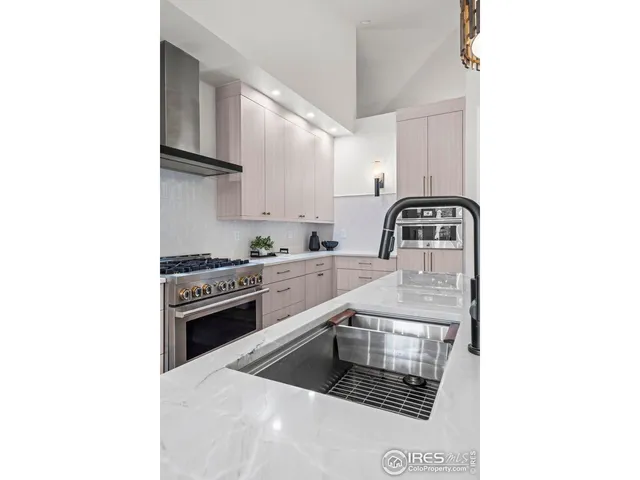 a kitchen with cabinets a sink and appliances