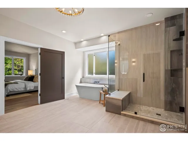 a bathroom with a bathtub and a window