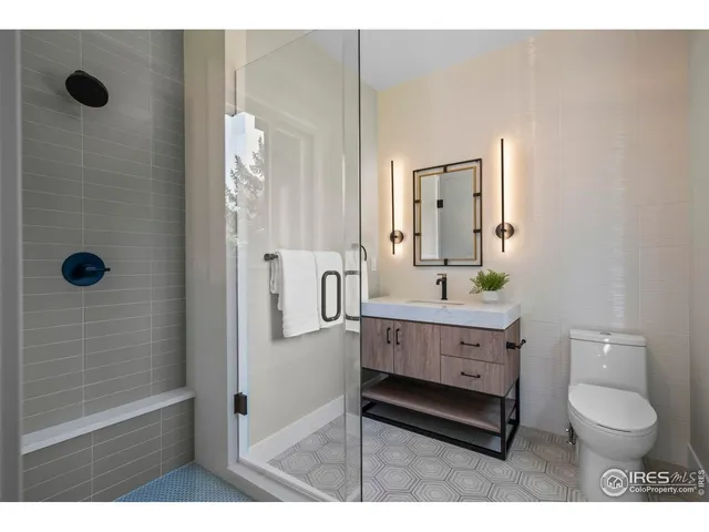 a spacious bedroom with a bed and a large window