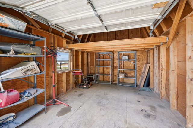 3732 Campbell Road Tooele, UT 84074 - Photo 44 of 69 Garage interior featuring a concrete floor and exposed wood framing