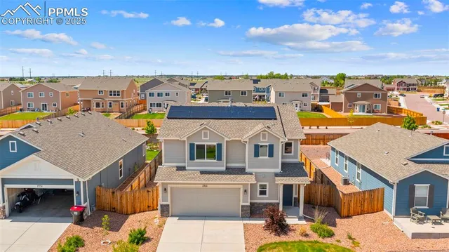 an aerial view of a house with a outdoor space