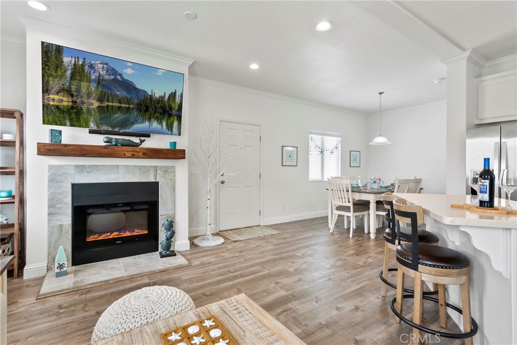 108 Bay Drive San Clemente, CA 92672 - Photo 13 of 28 a living room with furniture a fireplace and a floor to ceiling window