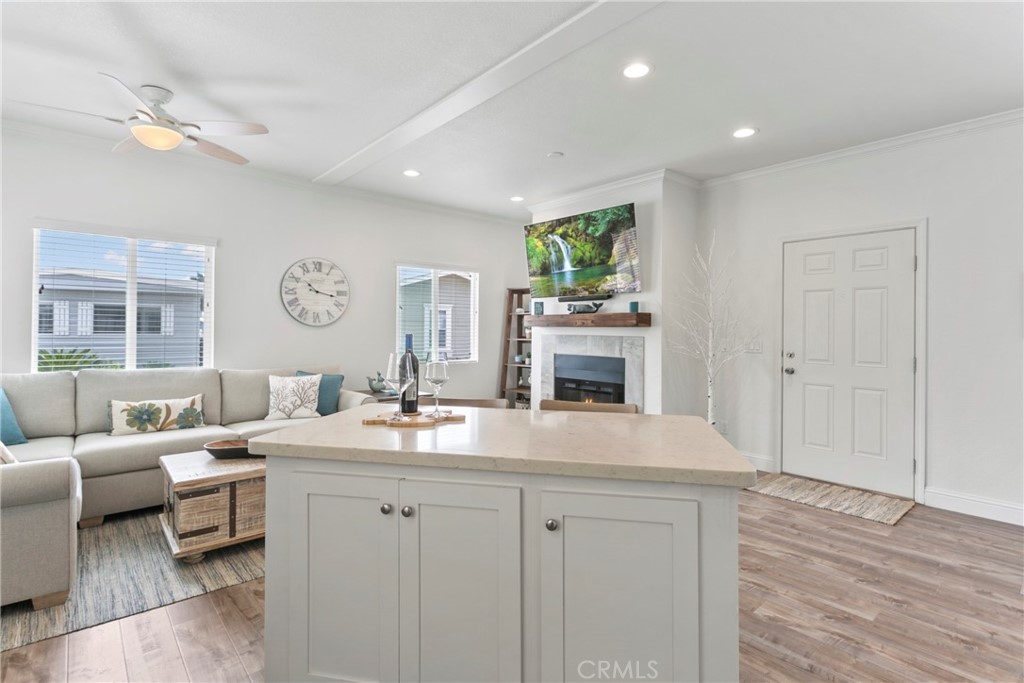 108 Bay Drive San Clemente, CA 92672 - Photo 16 of 28 a living room with furniture a fireplace and a table