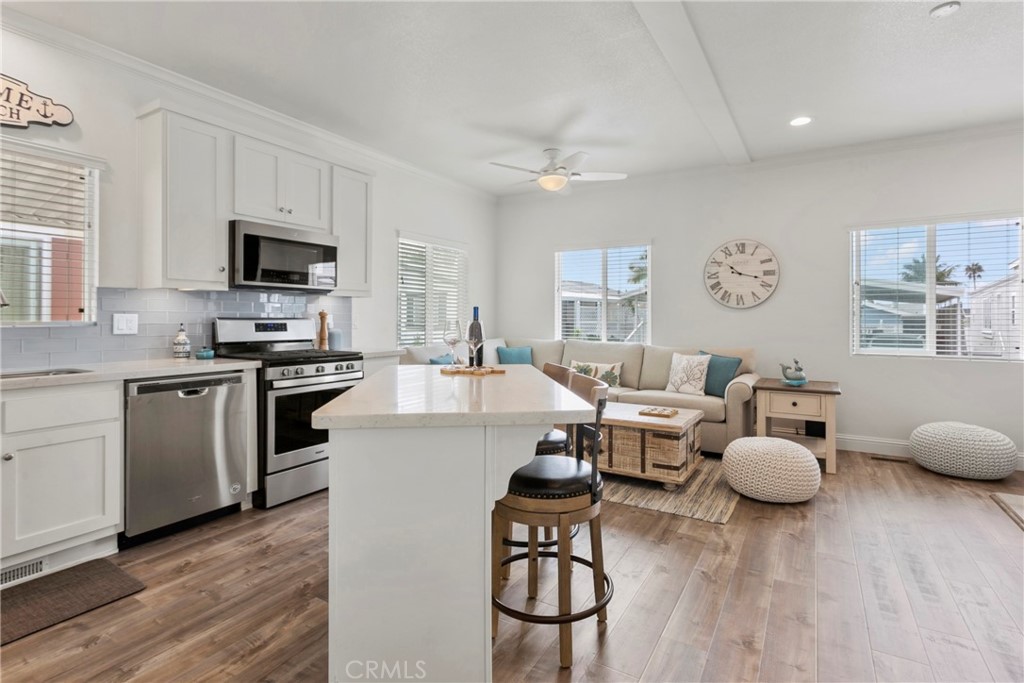 108 Bay Drive San Clemente, CA 92672 - Photo 17 of 28 a living room with furniture and a flat screen tv