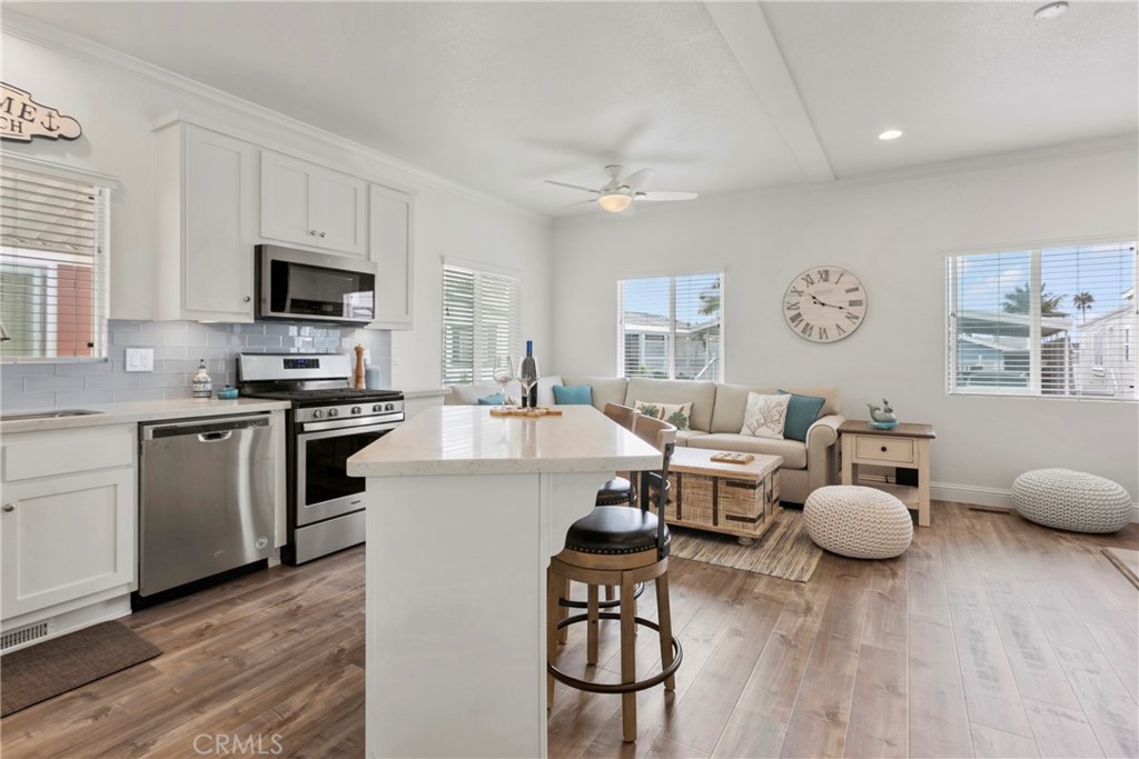 108 Bay Drive San Clemente, CA 92672 - Photo 23 of 28 a living room with furniture and a flat screen tv