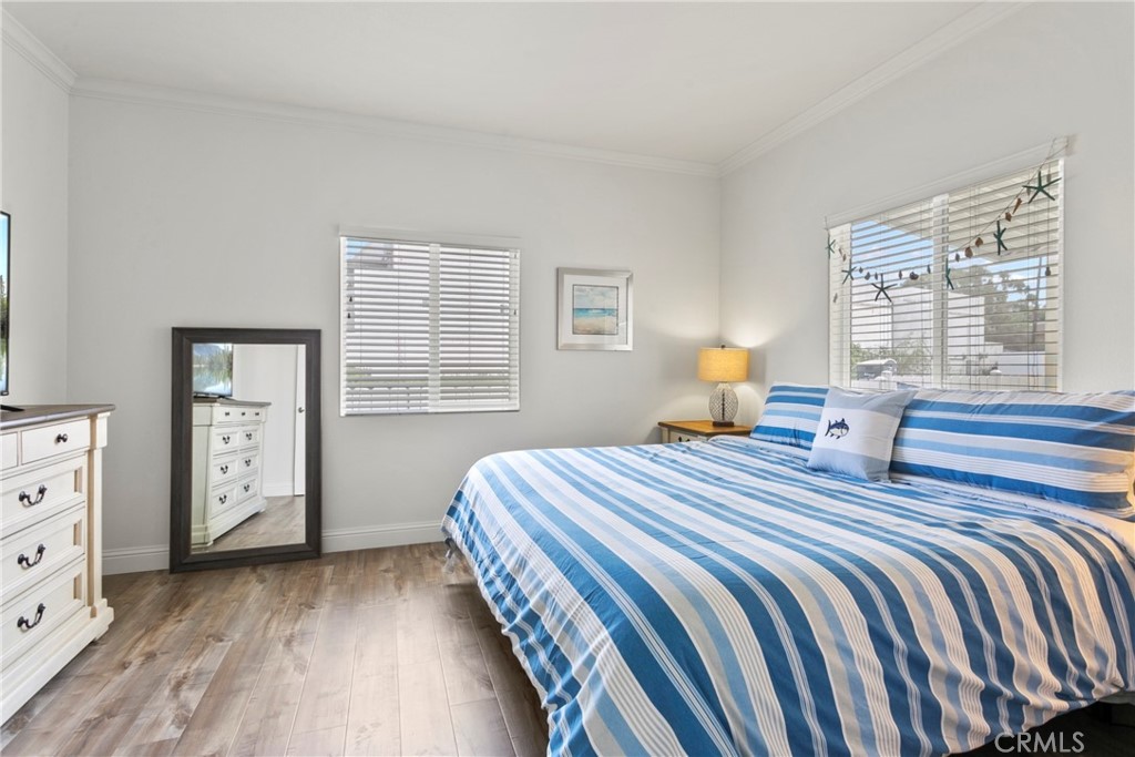 108 Bay Drive San Clemente, CA 92672 - Photo 24 of 28 a bedroom with a bed and a window with chair