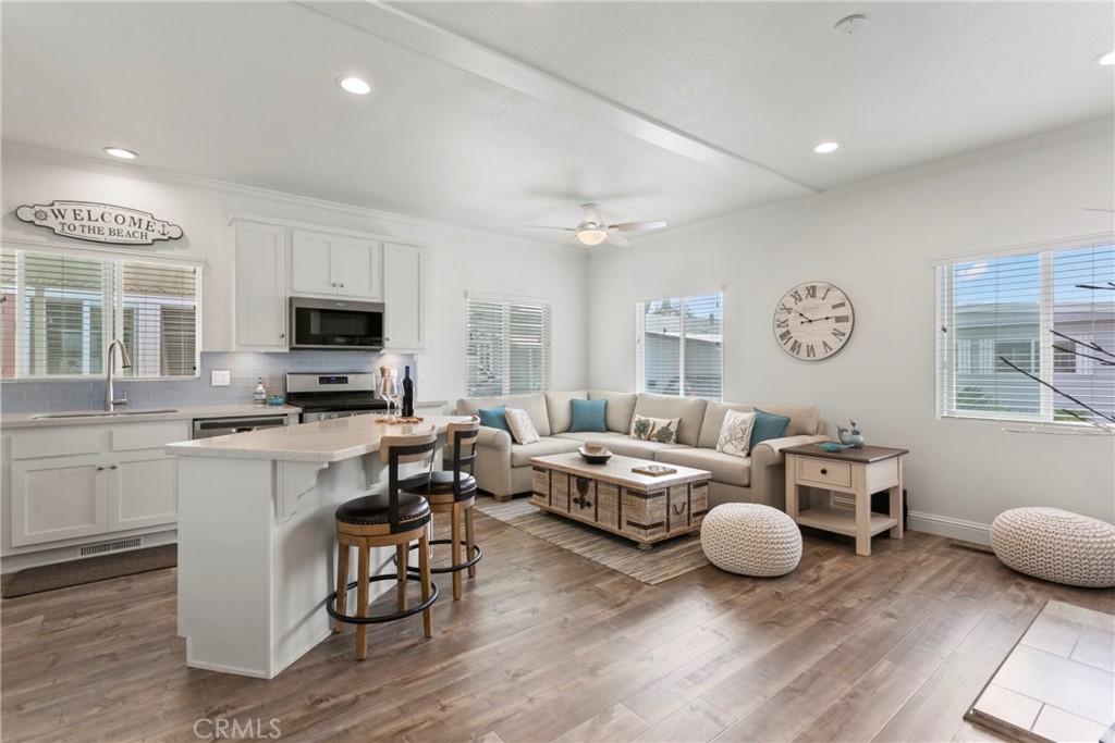 108 Bay Drive San Clemente, CA 92672 - Photo 10 of 28 a living room with furniture a fireplace and a flat screen tv