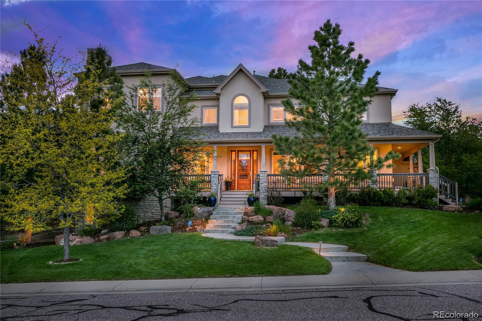 8397 Windhaven Drive Parker, CO 80134 - Photo 1 of 35 a front view of a house with garden