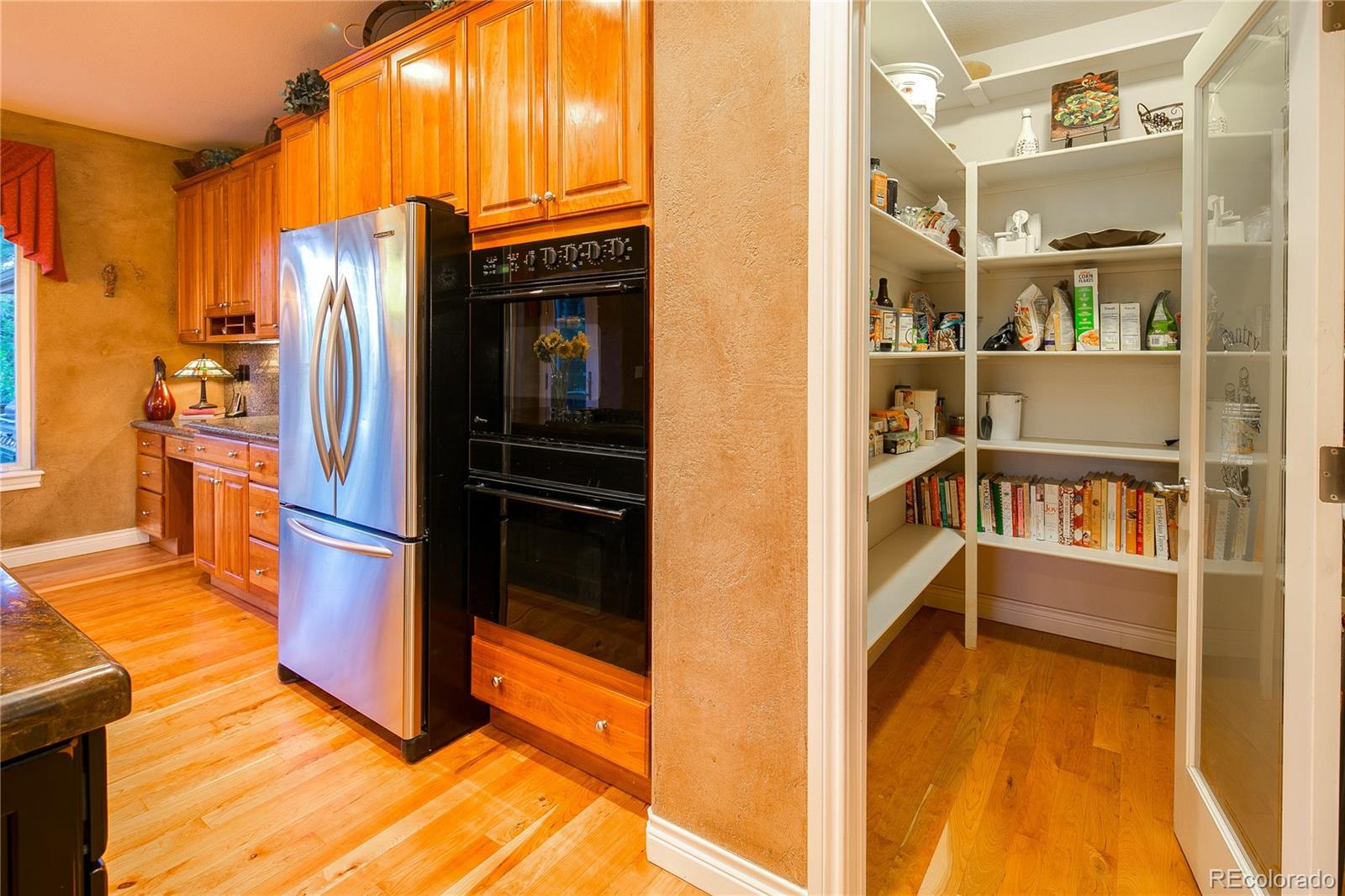 8397 Windhaven Drive Parker, CO 80134 - Photo 13 of 35 a view of a kitchen with furniture and a kitchen