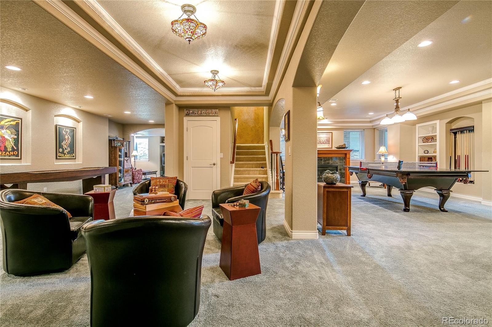 8397 Windhaven Drive Parker, CO 80134 - Photo 17 of 35 a living room with lots of furniture and kitchen view