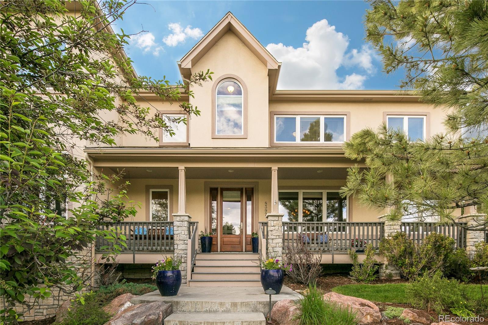 8397 Windhaven Drive Parker, CO 80134 - Photo 2 of 35 front view of a house with a porch