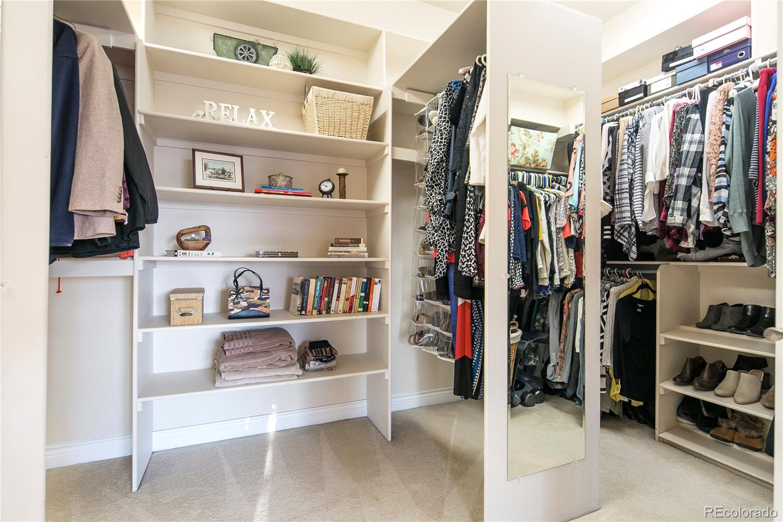 8397 Windhaven Drive Parker, CO 80134 - Photo 22 of 35 a view of walk in closet with clothes and shoes