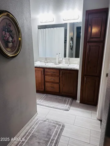 a bathroom with a sink and a mirror