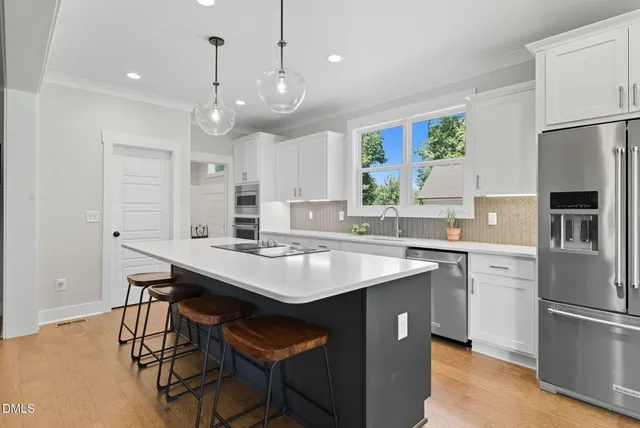 a kitchen with a sink and a window