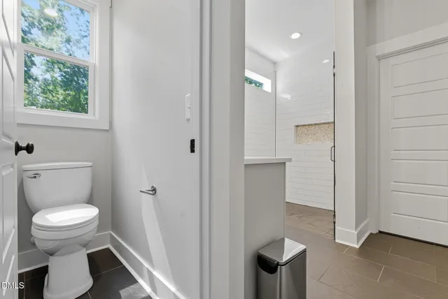 a bedroom with furniture and a chandelier
